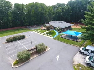 Northern Virginia Academy of Early Learning Burke Campus - aerial image of building, playgrounds, and parking area