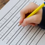Junior Kindergarten Pre-K at Northern Virginia Academy of Early Learning in Ashburn and Burke - closeup of child practicing writing the alphabet