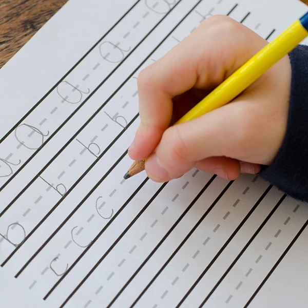 Junior Kindergarten Pre-K at Northern Virginia Academy of Early Learning in Ashburn and Burke - closeup of child practicing writing the alphabet