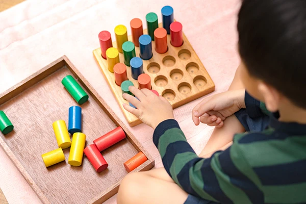 Montessori School in Burke VA - Northern Virginia Academy of Early Learning - young boy learning with educational toys