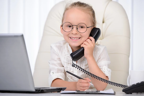 Contact Northern Virginia Academy of Early Learning - image of cute young girl looking business-like on the phone
