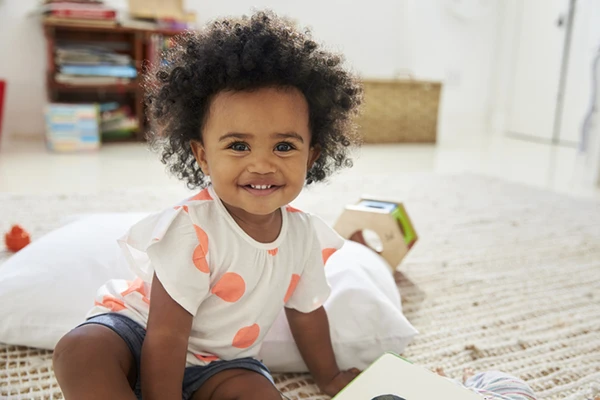 Two Year Old Daycare Preschool - Northern Virginia Academy of Early Learning - cute little girl smiling with toys